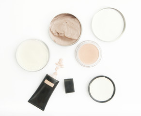 Top view of different cosmetics products on the white background