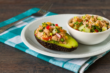 Avocado stuffed with tuna and fresh vegetables