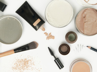 Top view of different cosmetics products on the white background