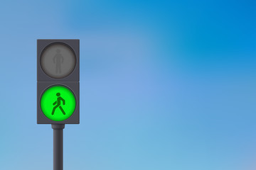 Pedestrian Traffic Light. Green light on. Sky background
