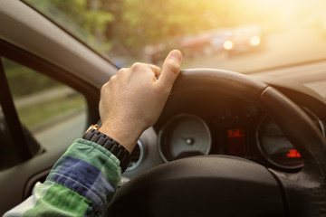 Driving a car in a sunny day