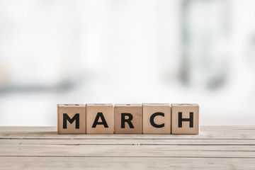 Wooden cubes with the word march - obrazy, fototapety, plakaty