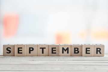 September sign on a wooden table