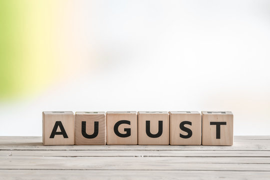 August sign on wooden cubes