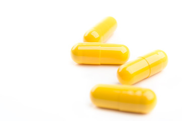 yellow capsules isolated