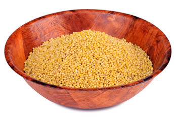 Deep bowl of millet isolated on white