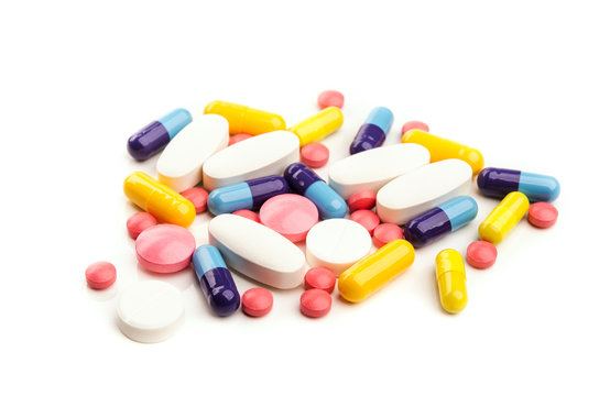 pile of colorful pills isolated