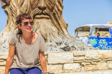 Young brunette girl at Matala, Crete, Greece.