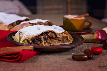 Apple strudel, apple pie and a cup of coffee. The atmosphere for a cozy romantic evening. Valentine's day.