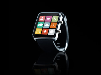 close up of black smart watch with app icons