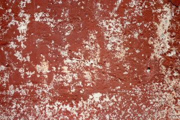Texture of old red paint on small area of surface