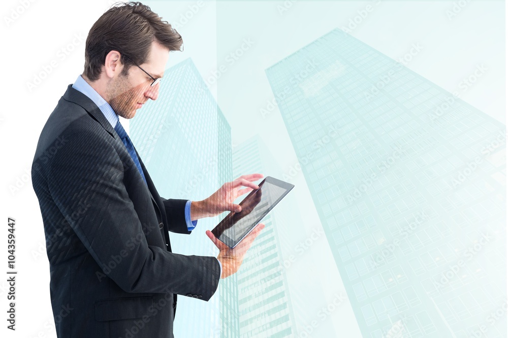 Poster Composite image of businessman standing while using a tablet pc