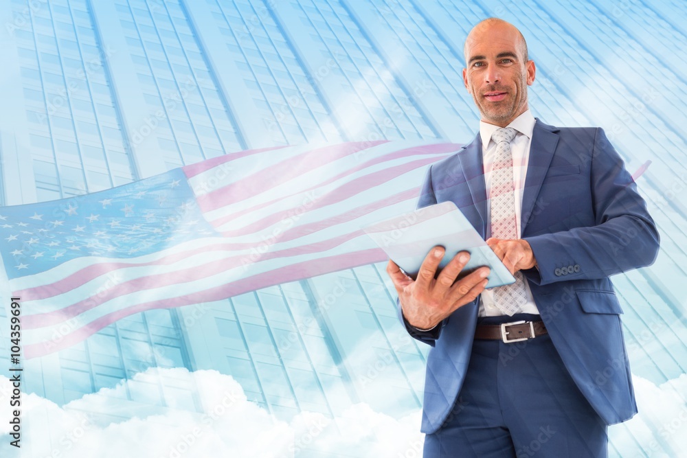 Poster composite image of businessman using a tablet and smiling at the camera
