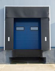 Sectional industrial blue door with windows