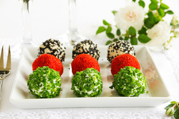 Snack-balls of goat cheese with spices.