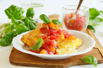 Fried brie with tomato salsa.