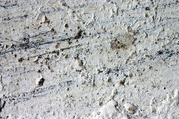 Texture of the old gray paint on a small area of the surface