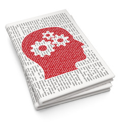 Learning concept: Head With Gears on Newspaper background