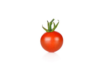 Small ripe tomato. Isolated on white background