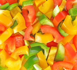 Surface coated with a sweet bell pepper cut into colorful pieces