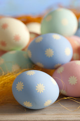 Colored Easter eggs on blue sky background