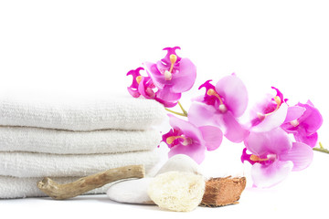 spa decoration with stones, towel, orchid, wooden parts, natural