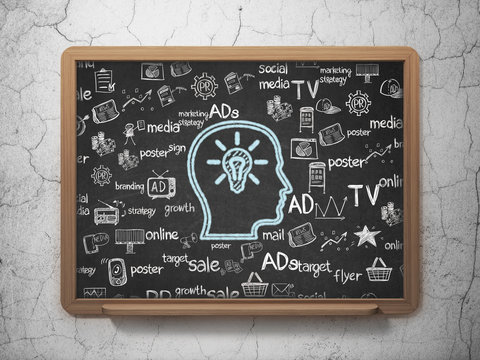 Marketing concept: Head With Lightbulb on School Board background