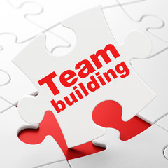 Business concept: Team Building on puzzle background