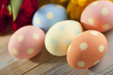 Five Easter eggs and flowers