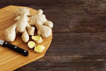 Fototapeta premium Ginger on wooden background