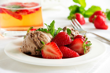 Chocolate ice cream with strawberries in balsamic sauce.