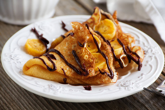 Pancakes with bananas and chocolate.