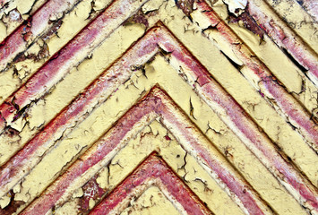 Red lines on yellow metal texture.