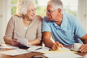 Senior couple counting bills