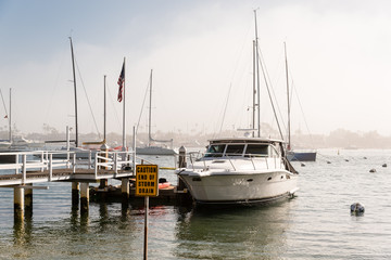 Fototapeta premium yacht mooring on a foggy day