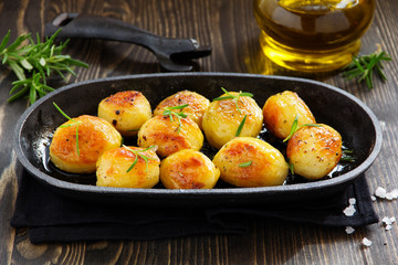 Baked potatoes with rosemary.