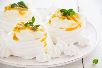 Dessert "Pavlova" of meringue with passion fruit.