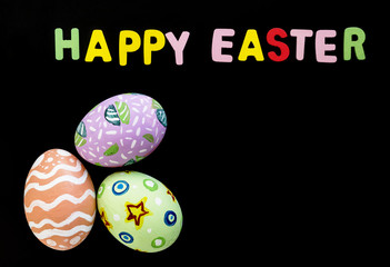 easter eggs and word spelling on black background