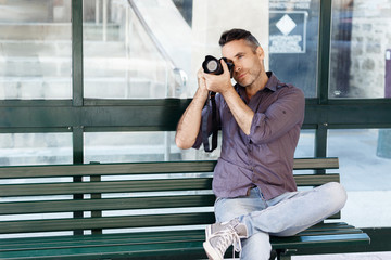 Male photographer taking picture