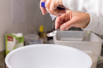 cook pouring baking powder