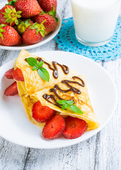 Pancakes with sliced strawberries