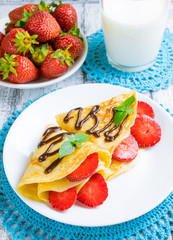 Pancakes with sliced strawberries