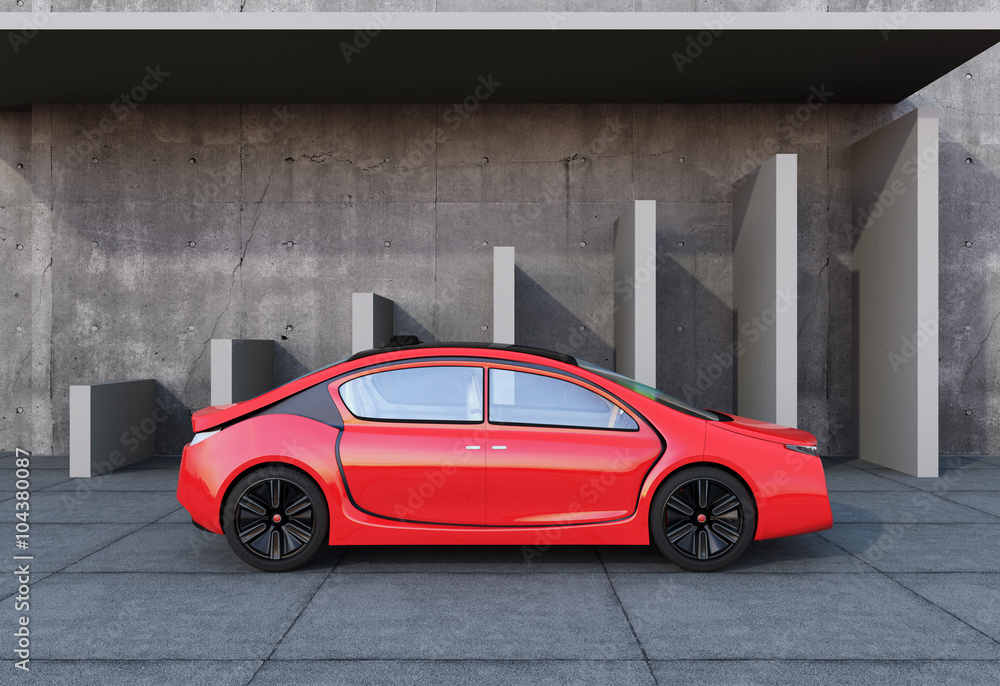 Poster side view of red autonomous car in front of geometric object background.