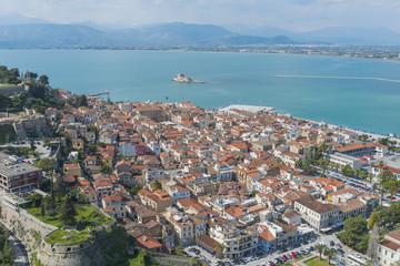 Fototapeta na wymiar Panoramic view above the beautiful old town of Nafplio on a summ
