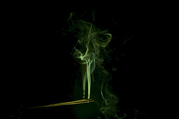 green abstract smoke on the black background