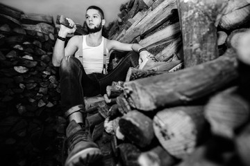 Obraz na płótnie Canvas Man with an ax near firewood stock