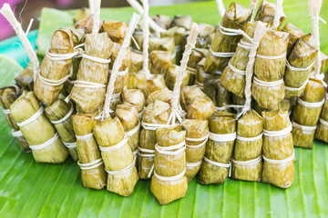 Sticky rice covered in banana leaf or 