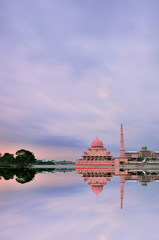 Putra Mosque in Putrajaya, Malaysia at dusk with reflection