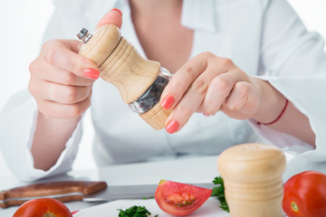 preparing tomato salad