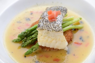 Braised cod fish on top of Asparagus